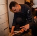 Contractors conduct equipment assessments on the USS Ronald Reagan (CVN 76)