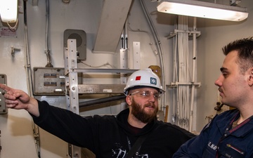 Contractors conduct equipment assessments on the USS Ronald Reagan (CVN 76)