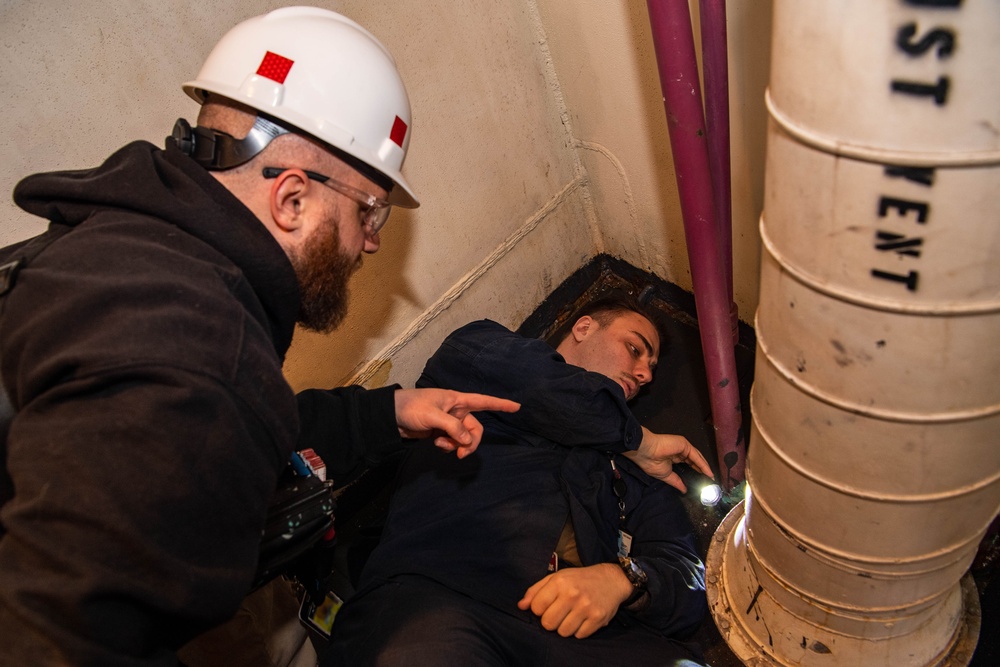 Contractors conduct equipment assessments on the USS Ronald Reagan (CVN 76)