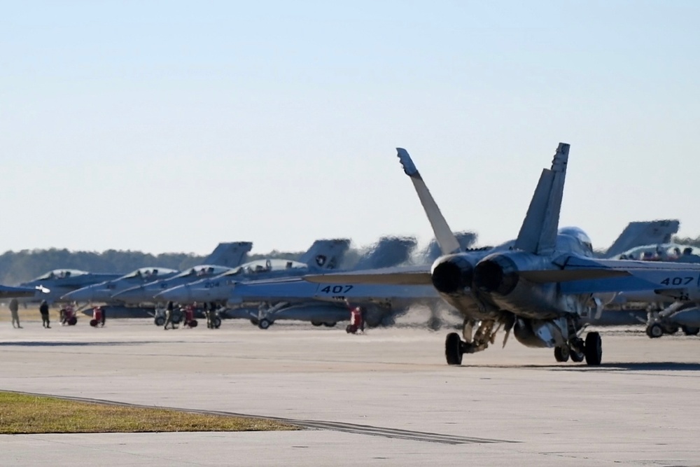 30 F/A-18 Super Hornets from Naval Air Station Oceana staged at Naval Air Station Jacksonville for a flyover honoring former U.S. President Jimmy Carter.