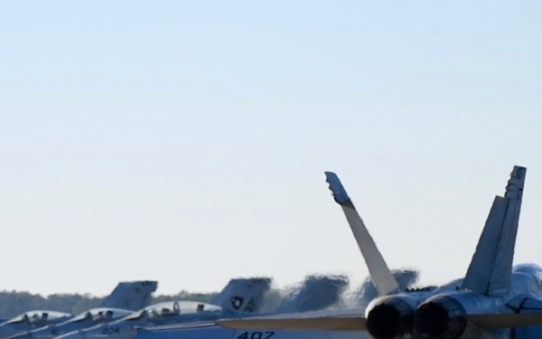 30 F/A-18 Super Hornets from Naval Air Station Oceana staged at Naval Air Station Jacksonville for a flyover honoring former U.S. President Jimmy Carter.