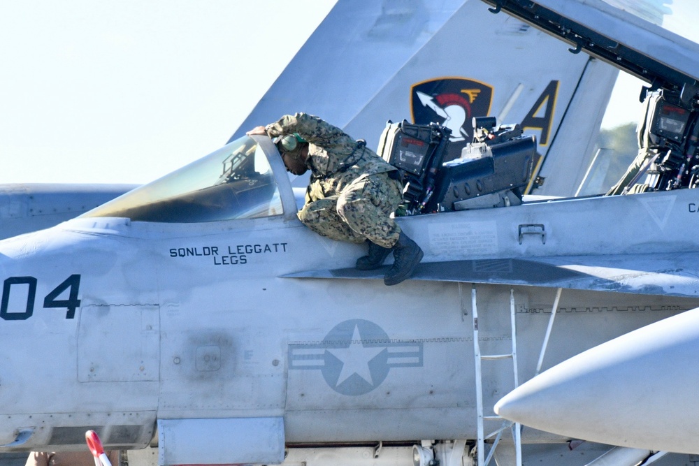 30 F/A-18 Super Hornets from Naval Air Station Oceana staged at Naval Air Station Jacksonville for a flyover honoring former U.S. President Jimmy Carter.