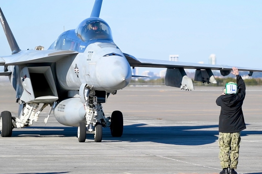 30 F/A-18 Super Hornets from Naval Air Station Oceana staged at Naval Air Station Jacksonville for a flyover honoring former U.S. President Jimmy Carter.