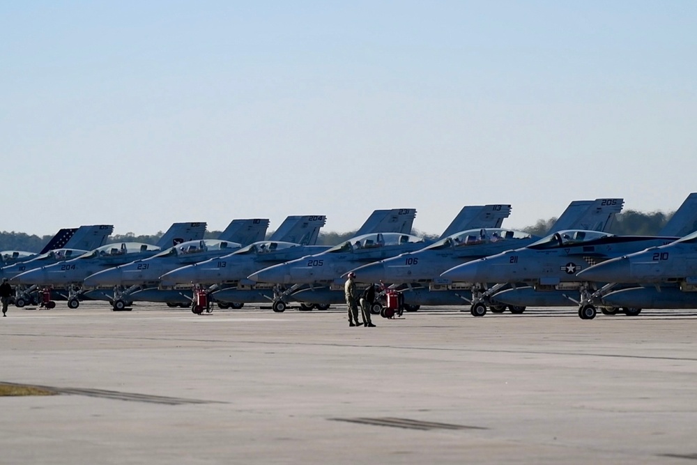 30 F/A-18 Super Hornets from Naval Air Station Oceana staged at Naval Air Station Jacksonville for a flyover honoring former U.S. President Jimmy Carter.