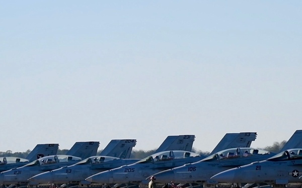 30 F/A-18 Super Hornets from Naval Air Station Oceana staged at Naval Air Station Jacksonville for a flyover honoring former U.S. President Jimmy Carter.