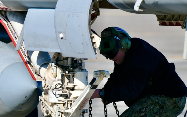 30 F/A-18 Super Hornets from Naval Air Station Oceana staged at Naval Air Station Jacksonville for a flyover honoring former U.S. President Jimmy Carter.
