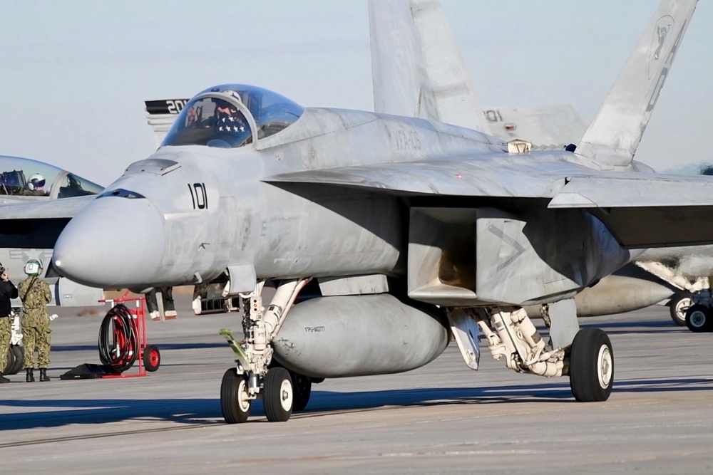 30 F/A-18 Super Hornets from Naval Air Station Oceana staged at Naval Air Station Jacksonville for a flyover honoring former U.S. President Jimmy Carter.