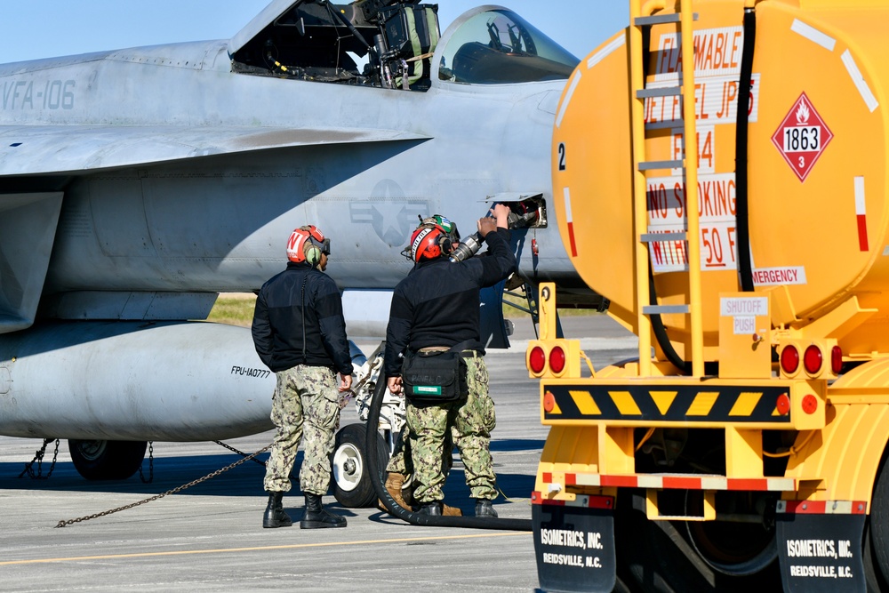 30 F/A-18 Super Hornets from Naval Air Station Oceana staged at Naval Air Station Jacksonville for a flyover honoring former U.S. President Jimmy Carter.