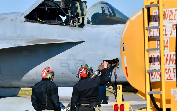 30 F/A-18 Super Hornets from Naval Air Station Oceana staged at Naval Air Station Jacksonville for a flyover honoring former U.S. President Jimmy Carter.