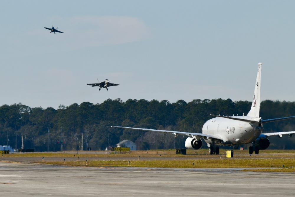 30 F/A-18 Super Hornets from Naval Air Station Oceana staged at Naval Air Station Jacksonville for a flyover honoring former U.S. President Jimmy Carter.