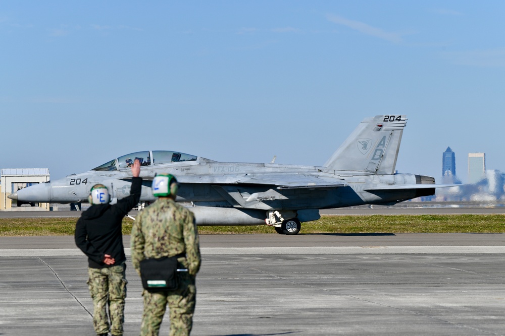 30 F/A-18 Super Hornets from Naval Air Station Oceana staged at Naval Air Station Jacksonville for a flyover honoring former U.S. President Jimmy Carter.