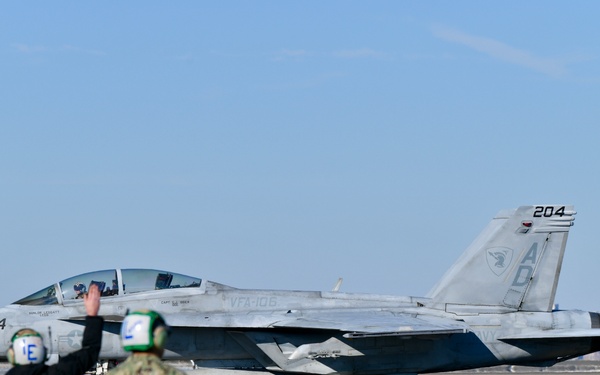 30 F/A-18 Super Hornets from Naval Air Station Oceana staged at Naval Air Station Jacksonville for a flyover honoring former U.S. President Jimmy Carter.