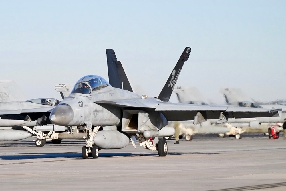 30 F/A-18 Super Hornets from Naval Air Station Oceana staged at Naval Air Station Jacksonville for a flyover honoring former U.S. President Jimmy Carter.