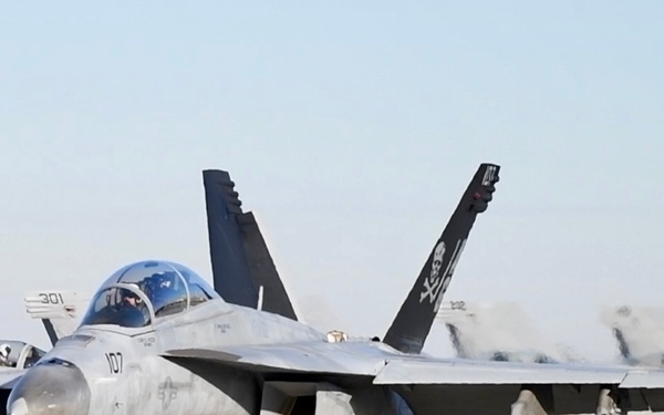 30 F/A-18 Super Hornets from Naval Air Station Oceana staged at Naval Air Station Jacksonville for a flyover honoring former U.S. President Jimmy Carter.
