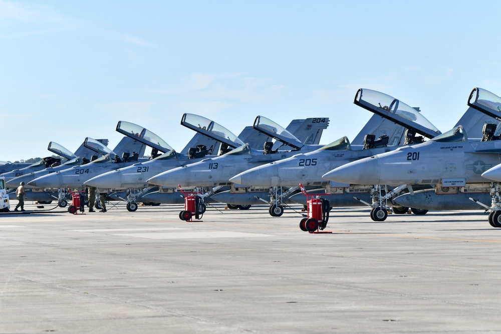 F/A-18 Super Hornets from Naval Air Station Oceana were staged at Naval Air Station Jacksonville for a flyover honoring former U.S. President Jimmy Carter