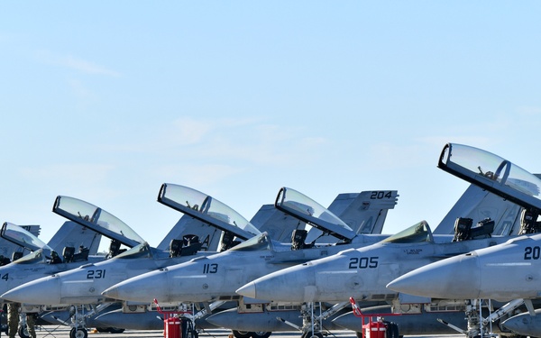 F/A-18 Super Hornets from Naval Air Station Oceana were staged at Naval Air Station Jacksonville for a flyover honoring former U.S. President Jimmy Carter