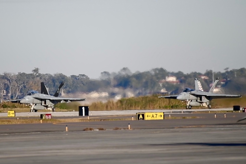 30 F/A-18 Super Hornets from Naval Air Station Oceana staged at Naval Air Station Jacksonville for a flyover honoring former U.S. President Jimmy Carter.