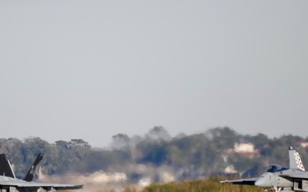 30 F/A-18 Super Hornets from Naval Air Station Oceana staged at Naval Air Station Jacksonville for a flyover honoring former U.S. President Jimmy Carter.