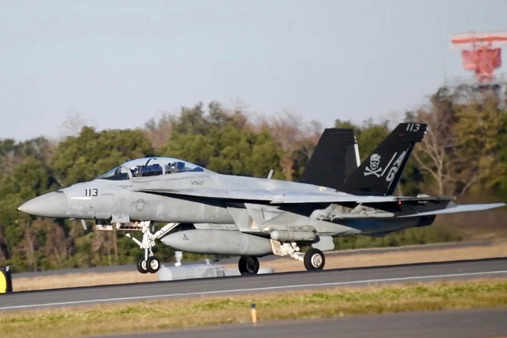 30 F/A-18 Super Hornets from Naval Air Station Oceana staged at Naval Air Station Jacksonville for a flyover honoring former U.S. President Jimmy Carter.