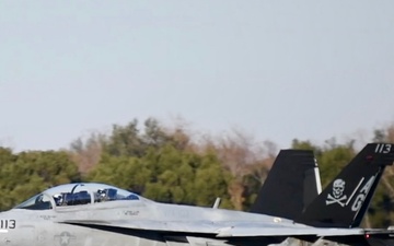 30 F/A-18 Super Hornets from Naval Air Station Oceana staged at Naval Air Station Jacksonville for a flyover honoring former U.S. President Jimmy Carter.