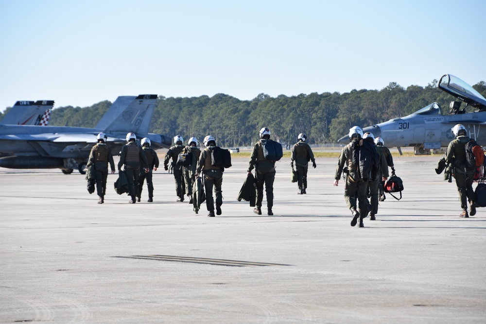 30 F/A-18 Super Hornets from Naval Air Station Oceana staged at Naval Air Station Jacksonville for a flyover honoring former U.S. President Jimmy Carter.