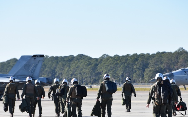 30 F/A-18 Super Hornets from Naval Air Station Oceana staged at Naval Air Station Jacksonville for a flyover honoring former U.S. President Jimmy Carter.