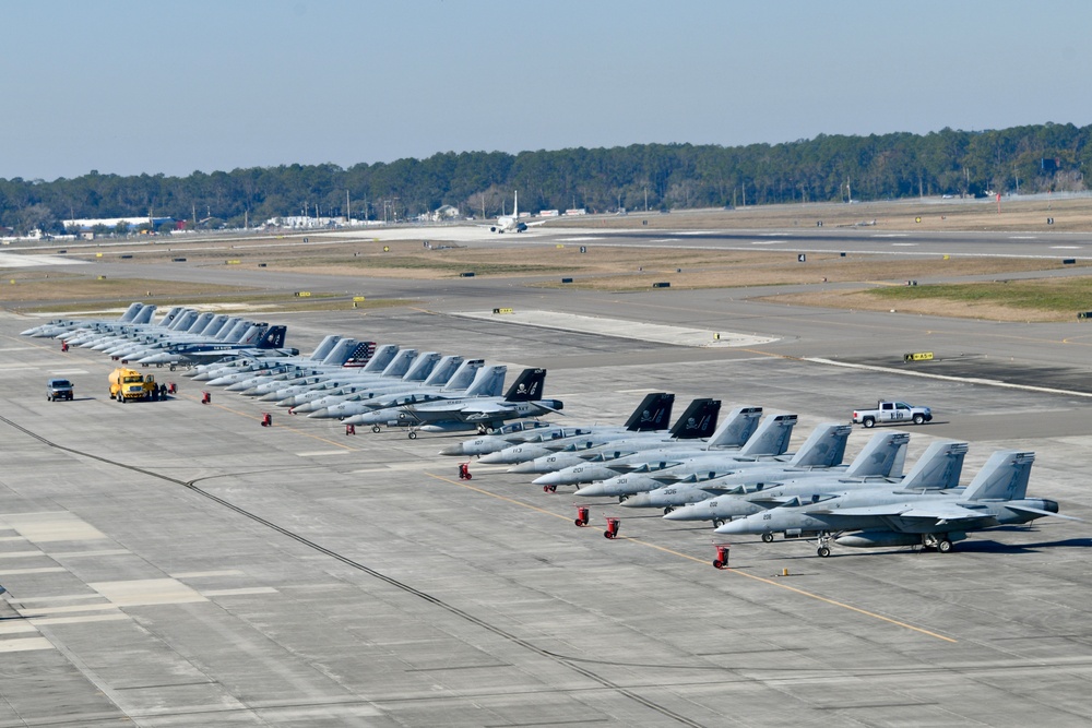 30 F/A-18 Super Hornets from Naval Air Station Oceana staged at Naval Air Station Jacksonville for a flyover honoring former U.S. President Jimmy Carter.