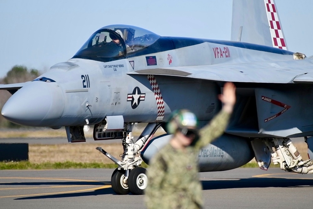 F/A-18 Super Hornets from Naval Air Station Oceana were staged at Naval Air Station Jacksonville for a flyover honoring former U.S. President Jimmy Carter