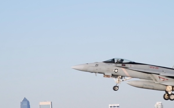 30 F/A-18 Super Hornets from Naval Air Station Oceana staged at Naval Air Station Jacksonville for a flyover honoring former U.S. President Jimmy Carter.