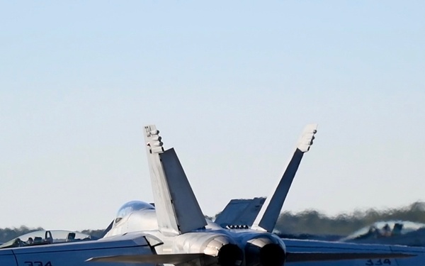 30 F/A-18 Super Hornets from Naval Air Station Oceana staged at Naval Air Station Jacksonville for a flyover honoring former U.S. President Jimmy Carter.