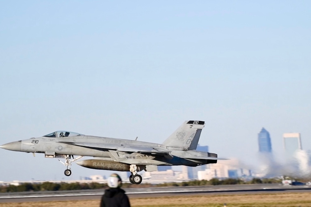 30 F/A-18 Super Hornets from Naval Air Station Oceana staged at Naval Air Station Jacksonville for a flyover honoring former U.S. President Jimmy Carter.