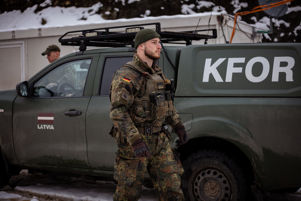 KFOR German and Latvian Soldiers conduct routine patrols in Mitrovica, Kosovo