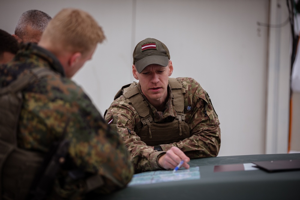 KFOR German and Latvian Soldiers conduct routine patrols in Mitrovica, Kosovo