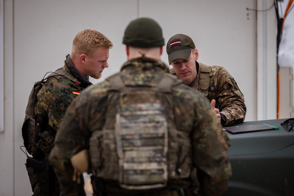 KFOR German and Latvian Soldiers conduct routine patrols in Mitrovica, Kosovo