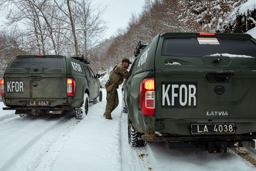 KFOR German and Latvian Soldiers conduct routine patrols in Mitrovica, Kosovo