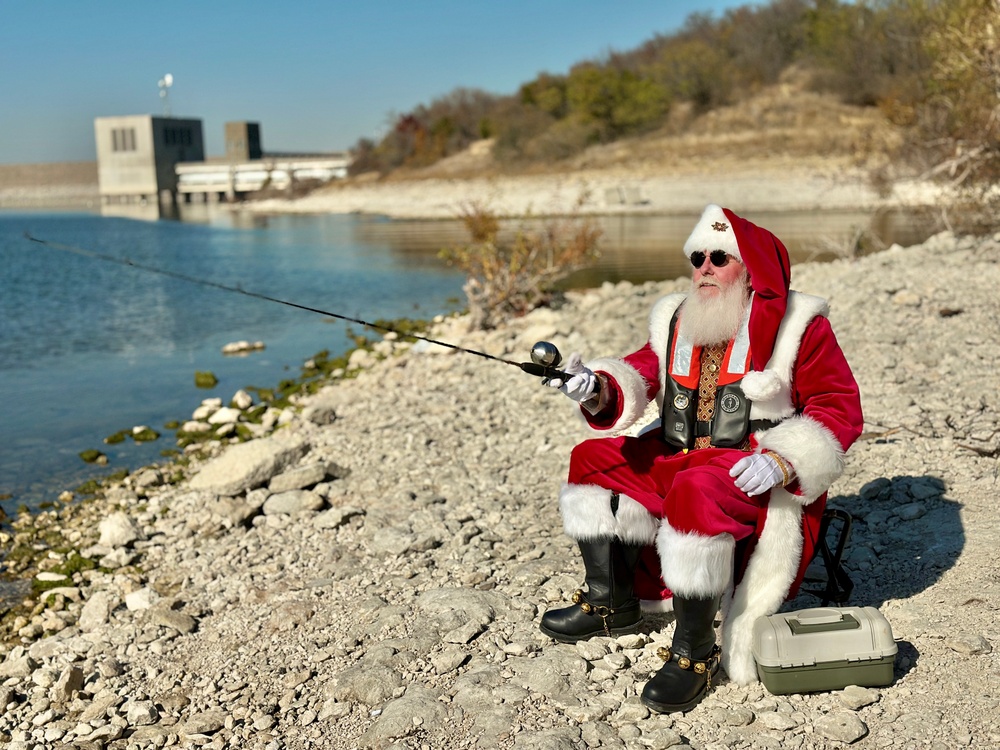 Santa Claus fishing and wearing life jacket at USACE project site