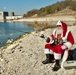 Santa Claus fishing and wearing life jacket at USACE project site