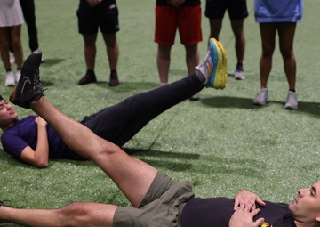 Coaches Participate in “Fit To Win” Workout