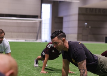 Coaches Participate in “Fit To Win” Workout