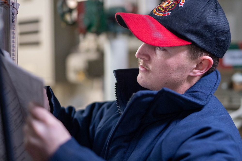 USS Ronald Reagan (CVN 76) Sailors check damage control equipment