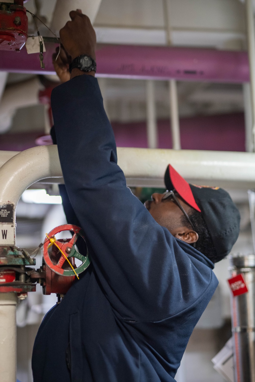 USS Ronald Reagan (CVN 76) Sailors check damage control equipment