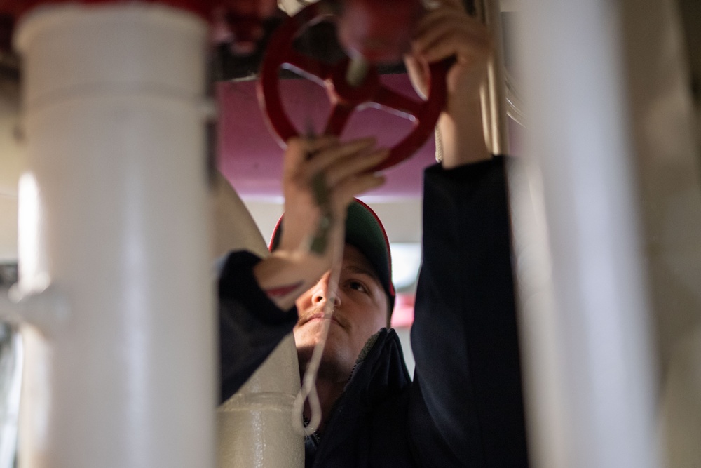 USS Ronald Reagan (CVN 76) Sailors check damage control equipment