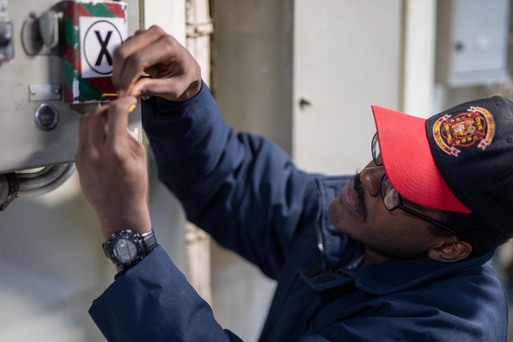 USS Ronald Reagan (CVN 76) Sailors check damage control equipment