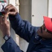 USS Ronald Reagan (CVN 76) Sailors check damage control equipment