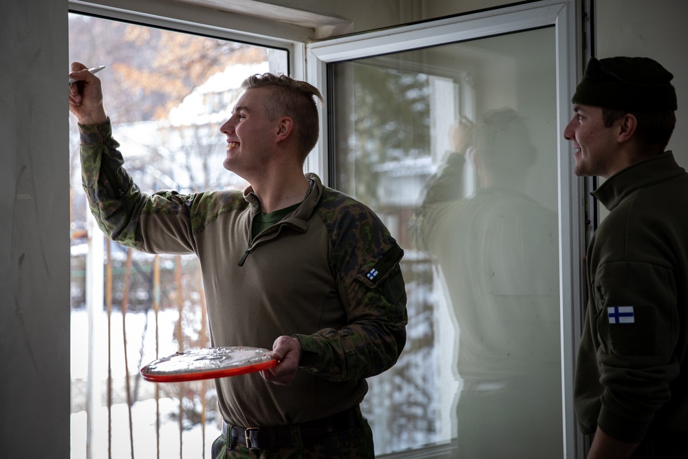 KFOR soldiers participate in a renovation project in Northern Kosovo