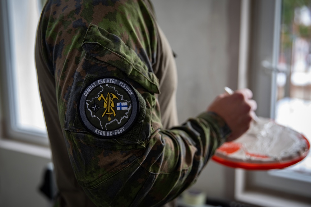 KFOR soldiers participate in a renovation project in Northern Kosovo