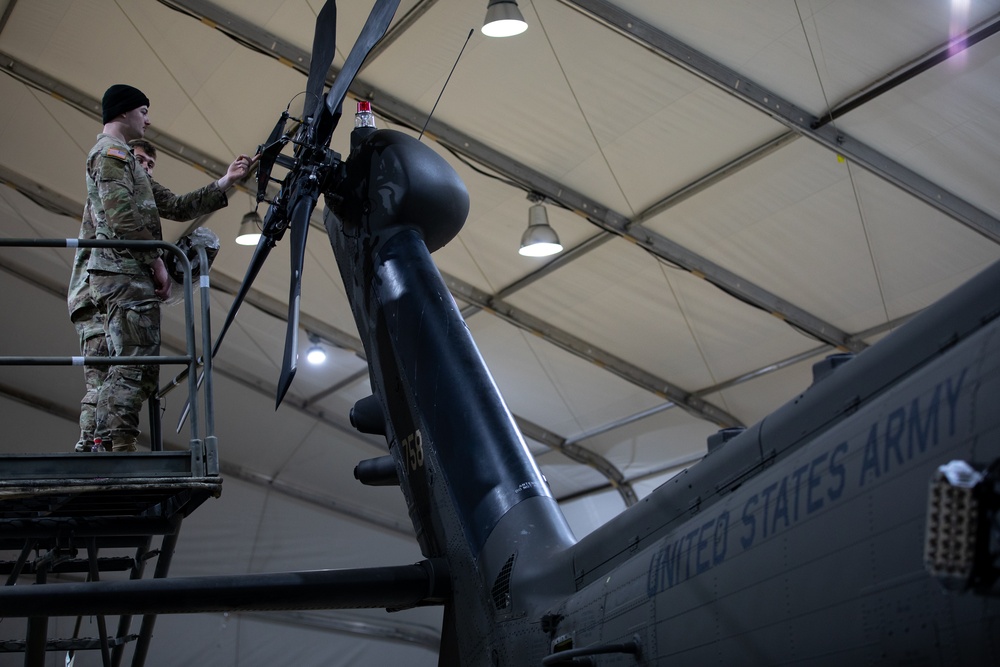 KFOR's Task Force Aviation perform repairs on UH-60M Black Hawk Helicopter