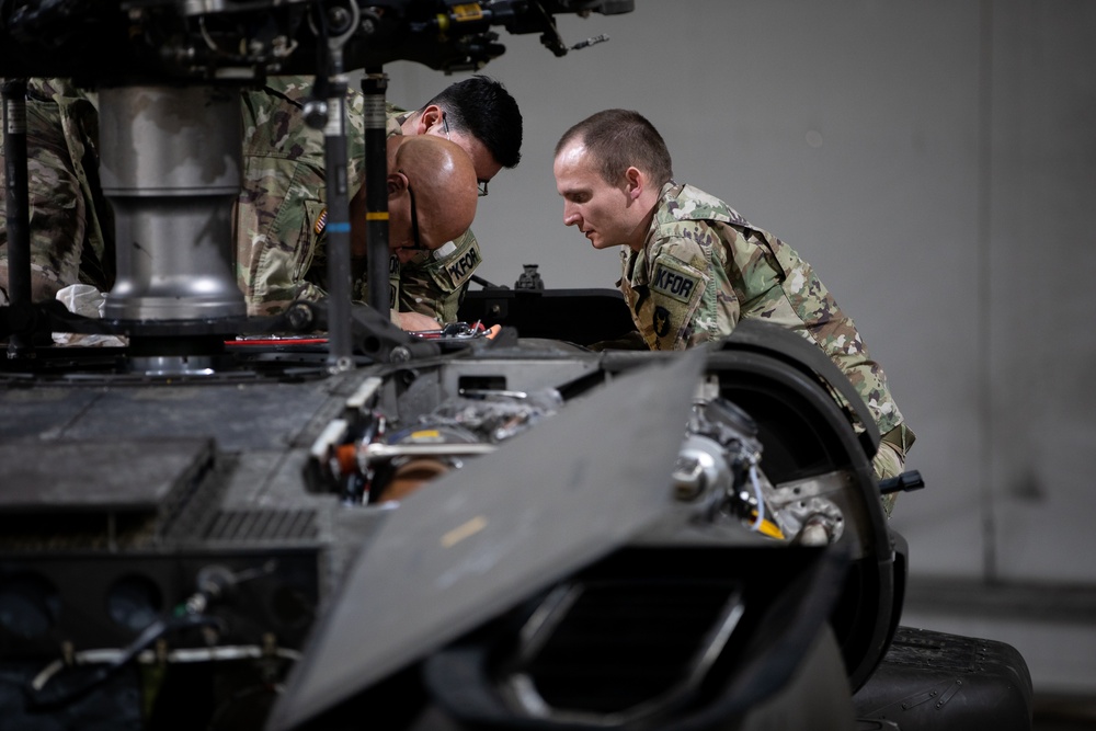 KFOR's Task Force Aviation perform repairs on UH-60M Black Hawk Helicopter