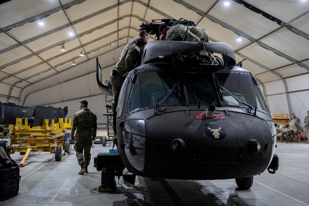 KFOR's Task Force Aviation perform repairs on UH-60M Black Hawk Helicopter