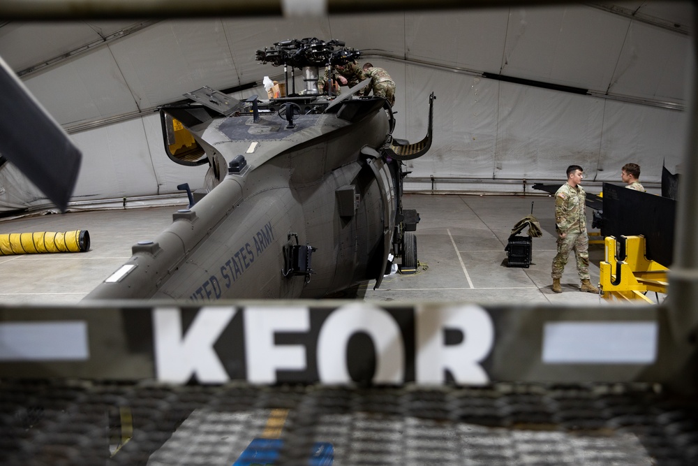 KFOR's Task Force Aviation perform repairs on UH-60M Black Hawk Helicopter